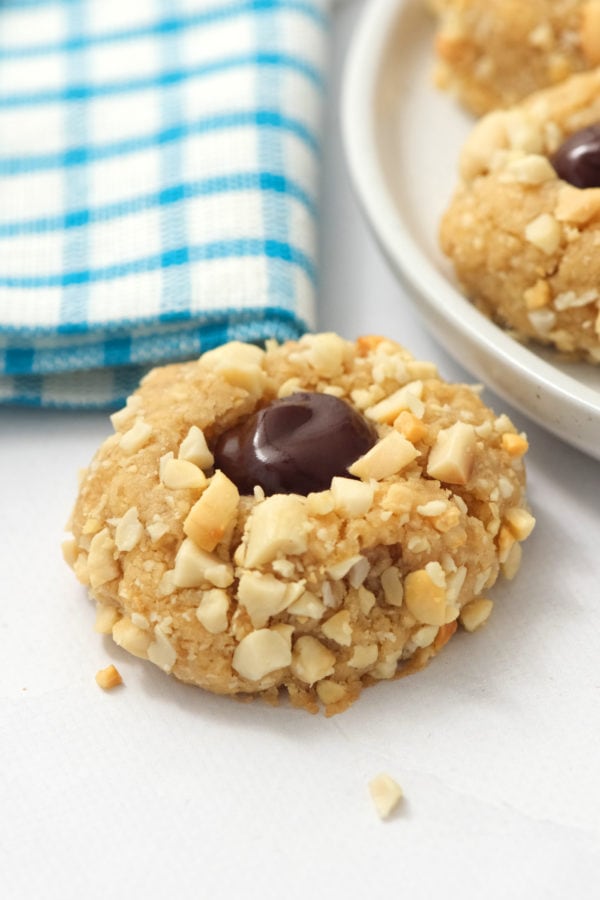 a chocolate filled Peanut Butter Thumbprint cookie