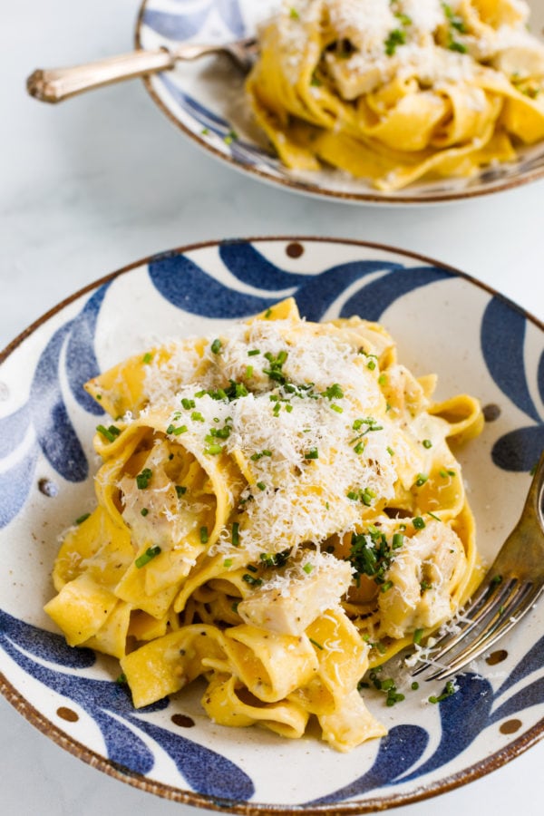 a bowl of lemon chicken with egg noodles