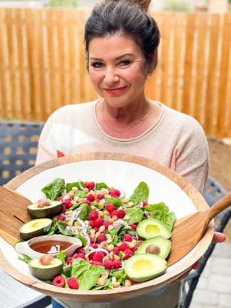 holding an epic spinach salad