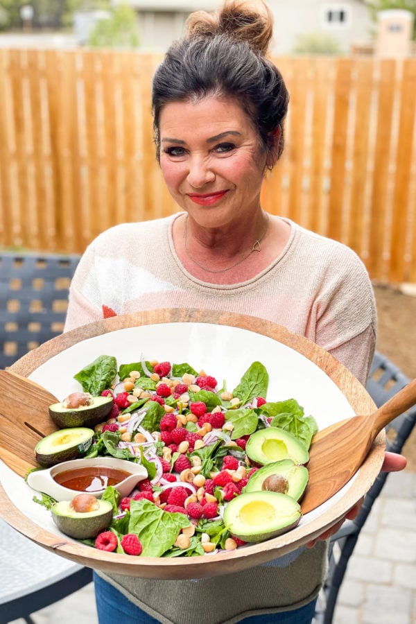 holding an epic spinach salad