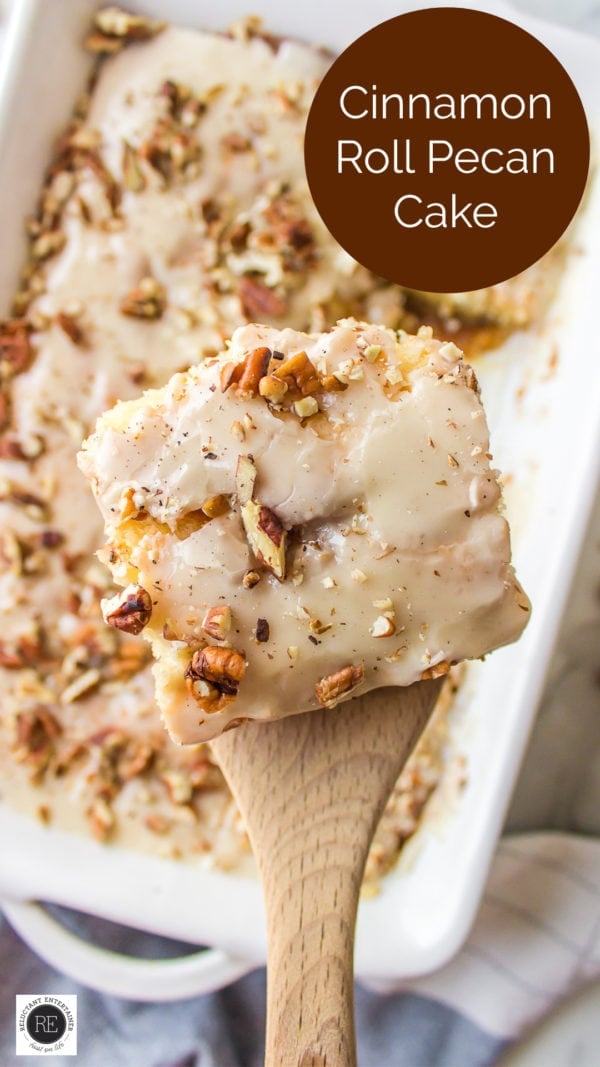 taking a piece of Homemade Cinnamon Roll Pecan Cake