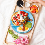 breakfast board in bed with coffee