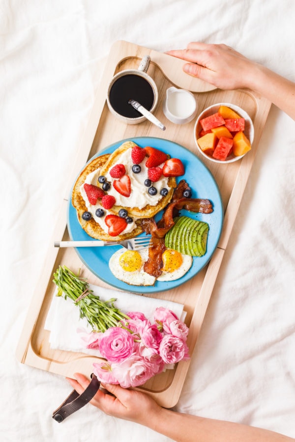 breakfast board in bed with coffee