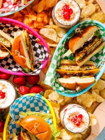 a turkey burger board with grilled pineapple and onions