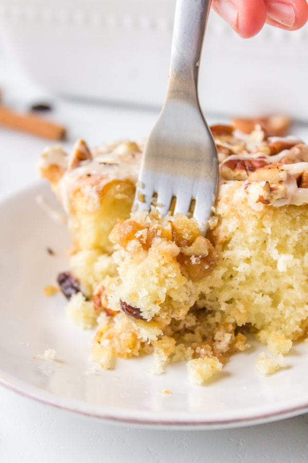 a fork bite of Homemade Cinnamon Roll Pecan Cake