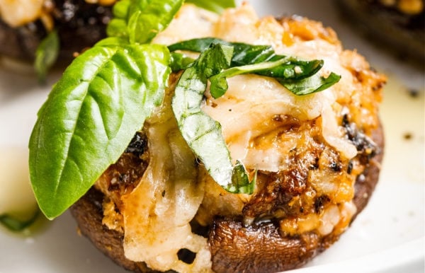 a Tuna Sun-Dried Tomato Stuffed Mushroom with basil