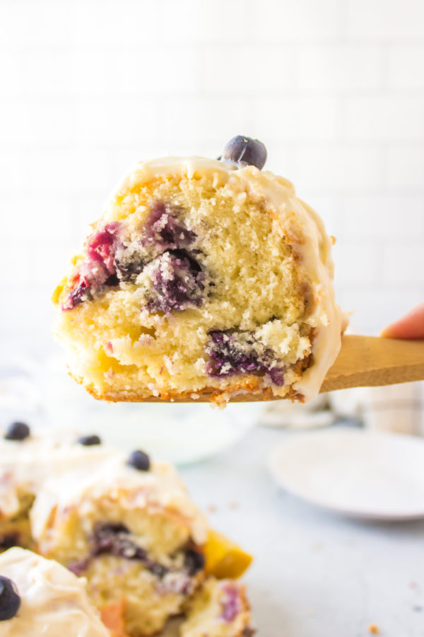 a slice of Lemon Blueberry Bundt Cake