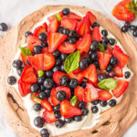 Strawberry Blueberry Chocolate Pavlova with cream