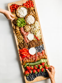 taking a bite of Summer Snack Board