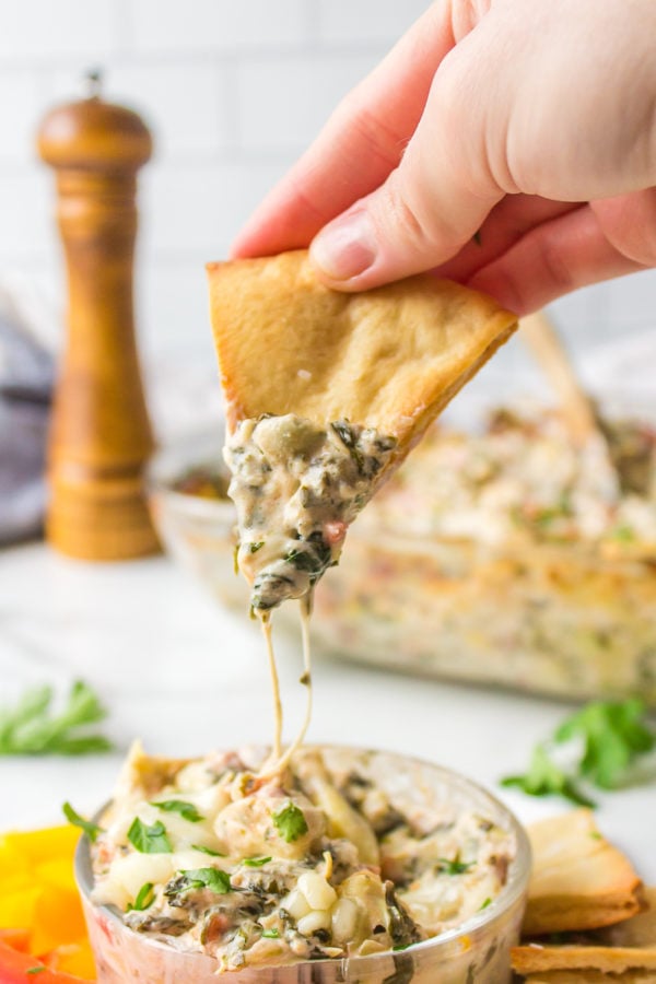 cheesy bite of Cake Pan Artichoke Dip