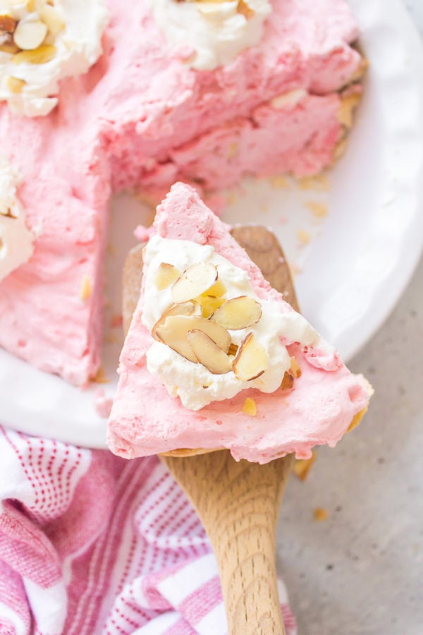 cutting out a piece of Oregon Raspberry Cloud Pie