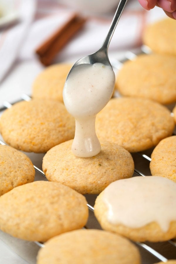 frosting the pumpkin cookies