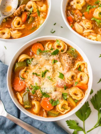 three bowls of tortellini soup