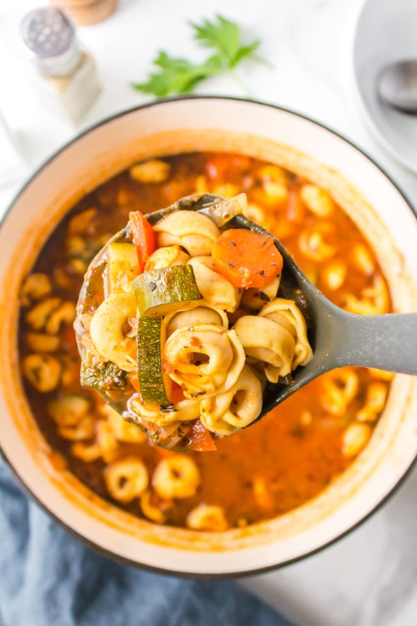 spoonful of soup with tortellini