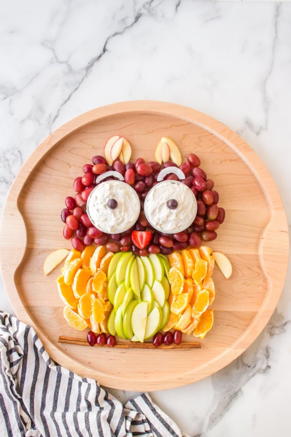 an owl made out of fruit on board