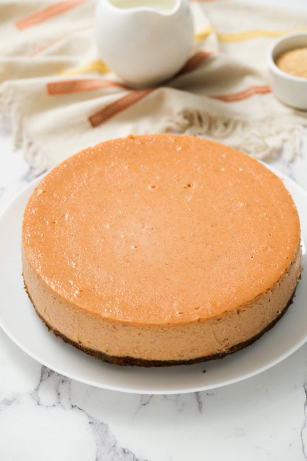 a baked Sweet Potato Cheesecake With gorgeous color and plenty of flavor