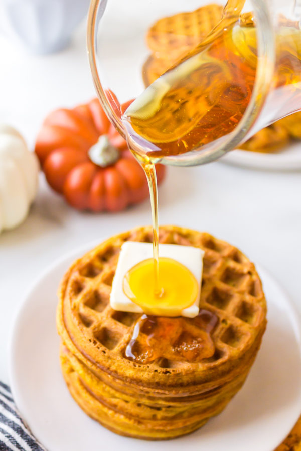 drizzling syrup on waffles