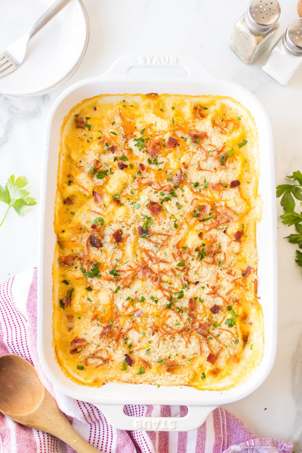 9x13 pan of cheesy bacon gratin with cauliflower