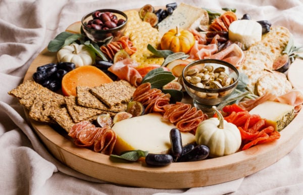 fall cheese board with pumpkin