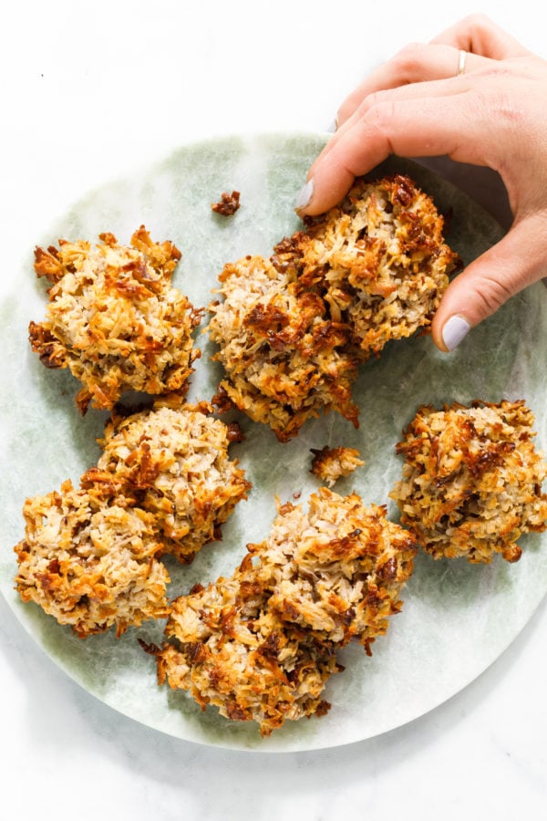 taking a bite of Coconut Macaroon Cookies