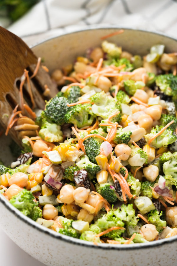 stirring a chickpea salad