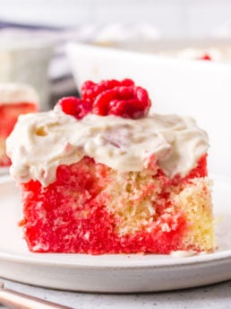 Poke Cake with raspberries frosting