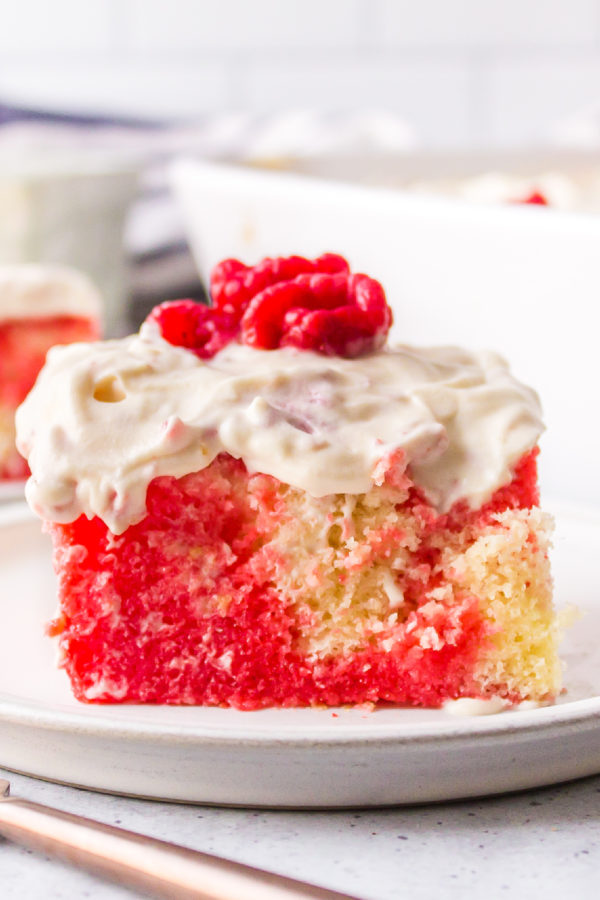 Poke Cake with raspberries frosting