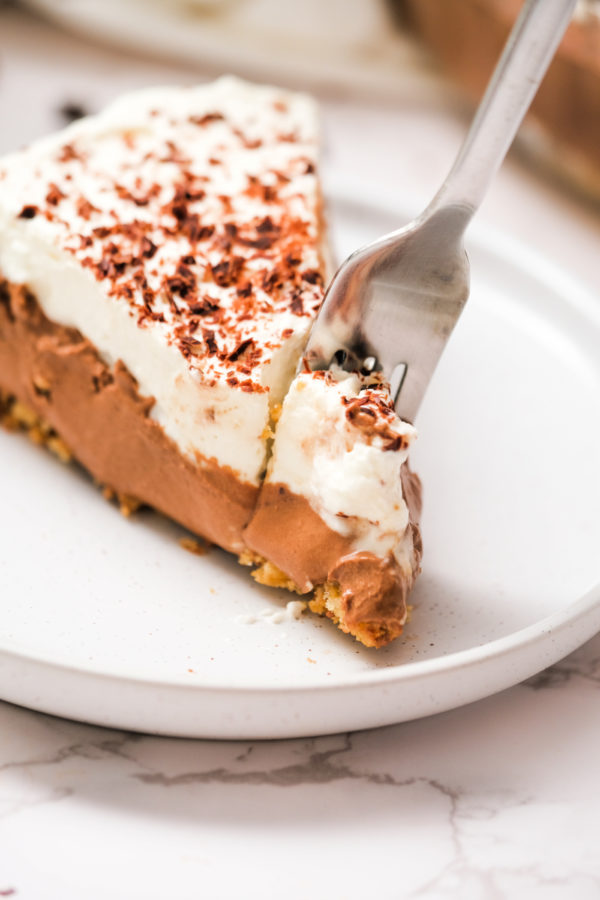 taking a bite of mousse pie