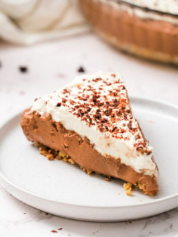 a serving of No-Bake Chocolate Mousse Pie with shaved chocolate