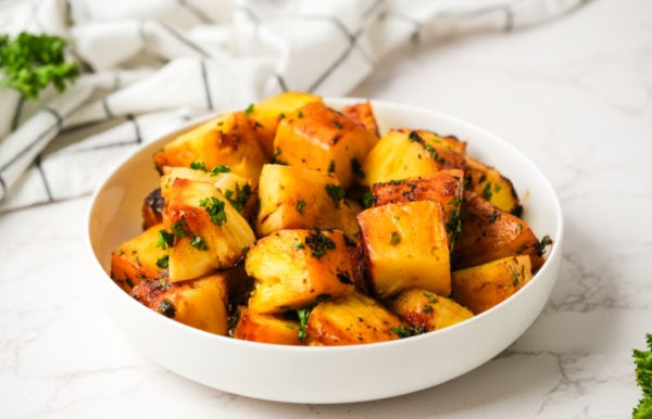 a bowl of Grilled Tequila-Pineapple Skewers