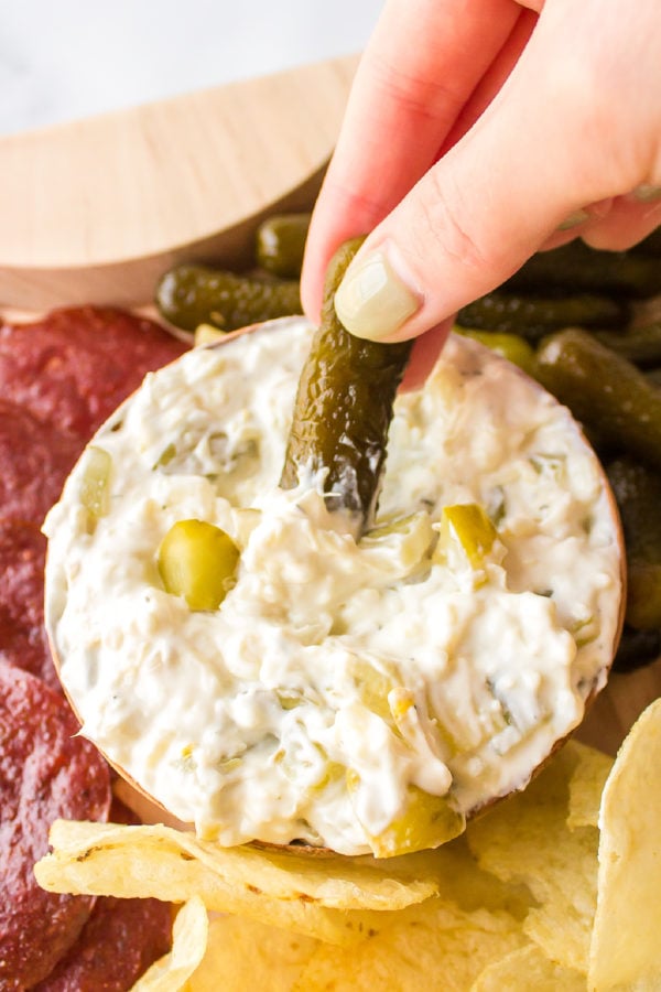 dipping a pickle into dip
