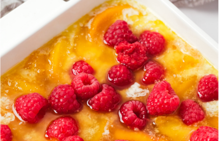 adding raspberries to a cobbler
