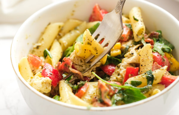 a bite of pasta salad with chicken