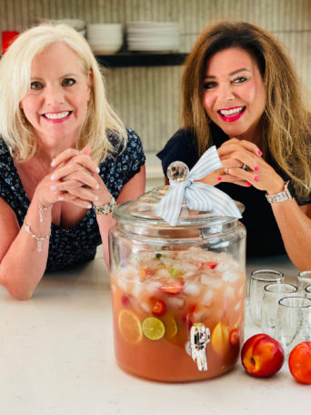 ladies making beverage jar of Carlo Rossi Sangria