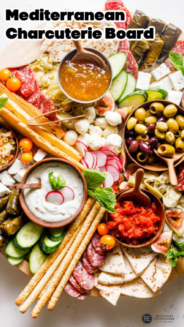 Mediterranean Cheese Board with charcuterie meats and bread sticks