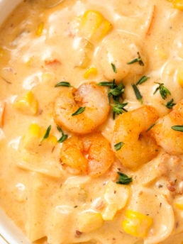 shrimp on top of a corn bisque
