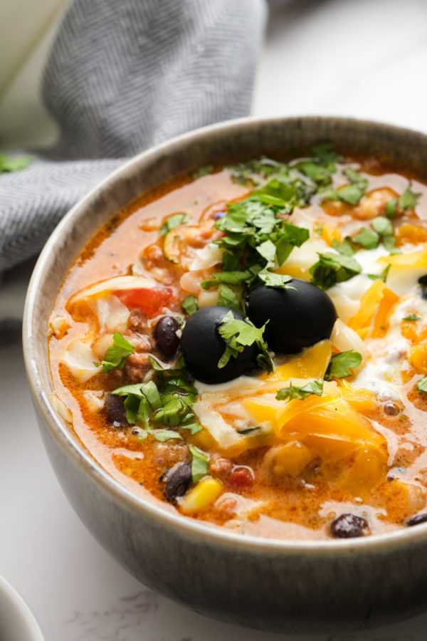 Bowl of Mexican soup with olives