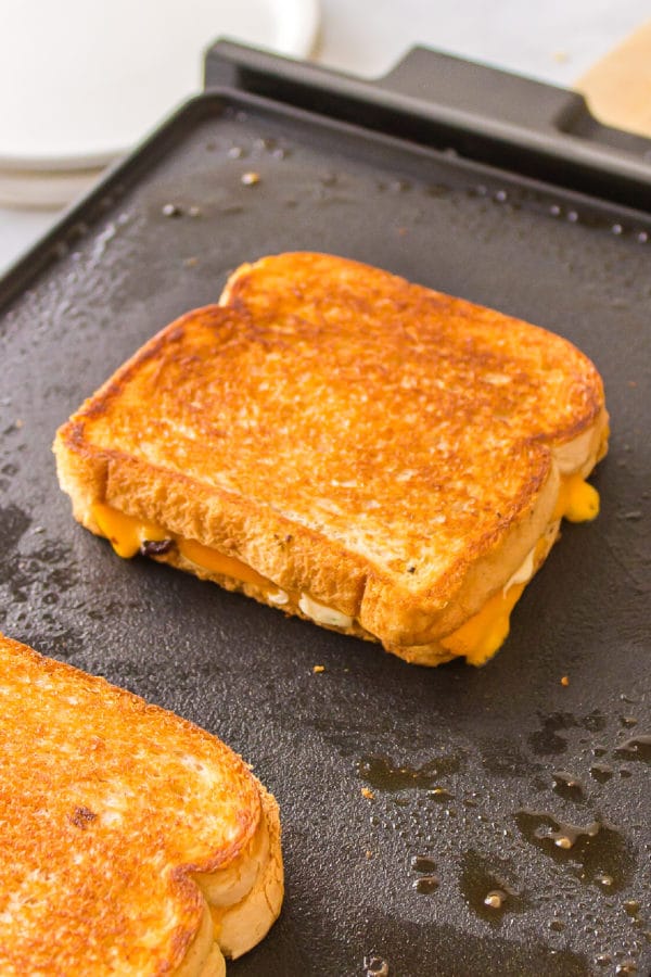 toasting a cheese sandwich on grill