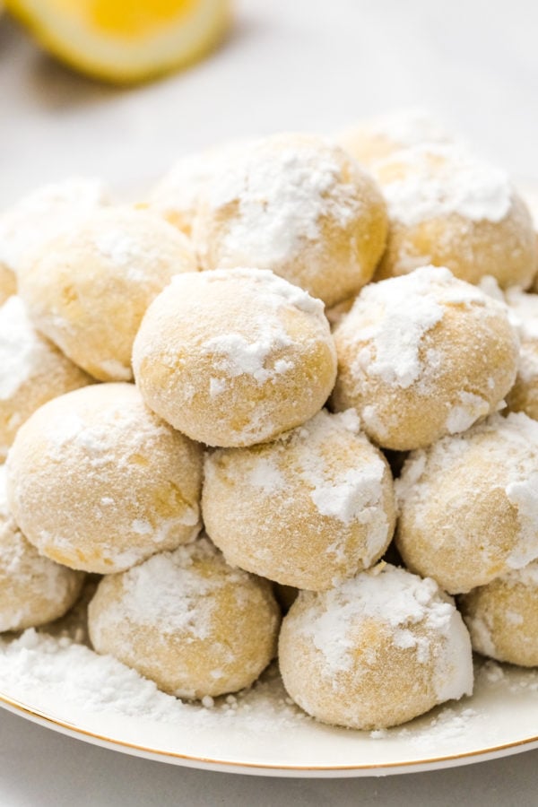 rolled snowball cookies with lemon