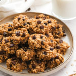 a plate of cookies with milk