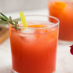 glass of punch with rosemary