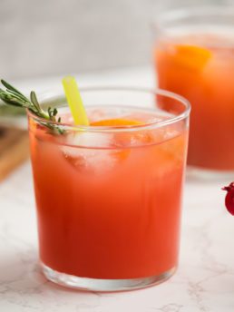 glass of punch with rosemary