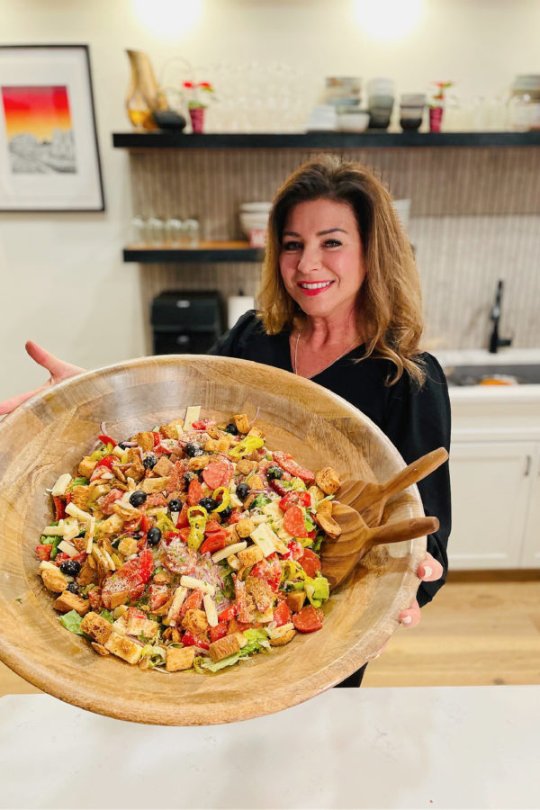 woman holding an epic salad bowl