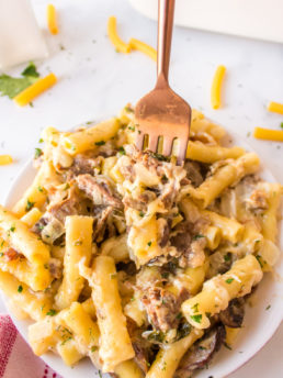 fork bite of pasta with meat