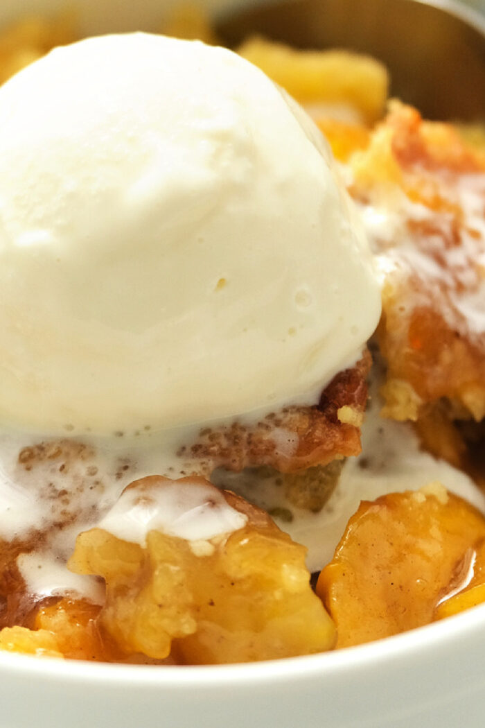 serving of peach cobbler with ice cream