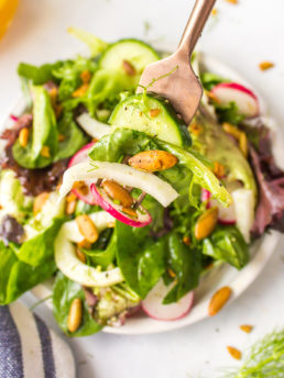 a salad with greens and dressing