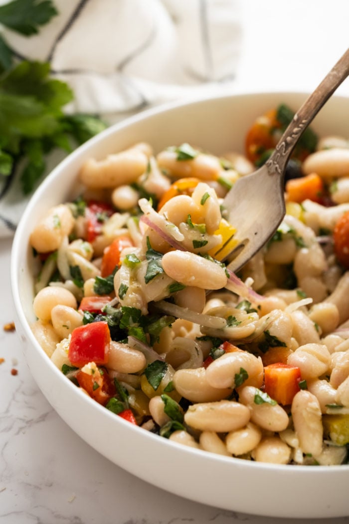 bite of salad with white beans