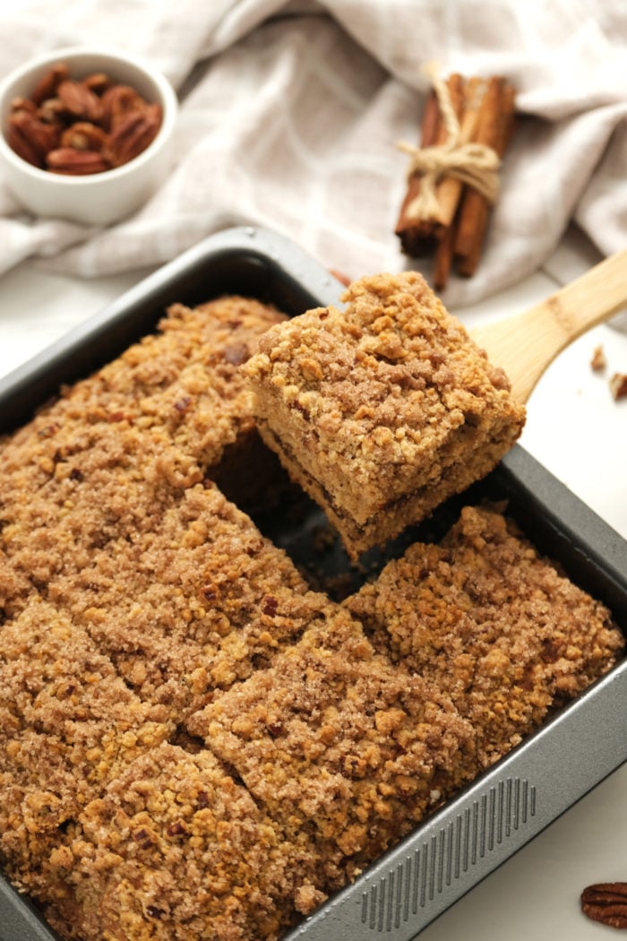 cutting a piece of cake with applesauce