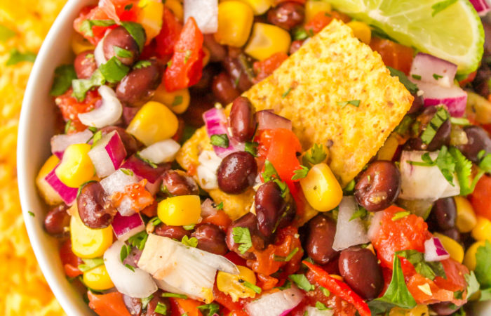 a bite of Spicy Black Bean Salsa dip