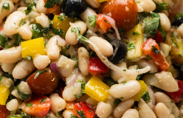 Tuscan White Bean Salad with olives, tomatoes red onion, peppers